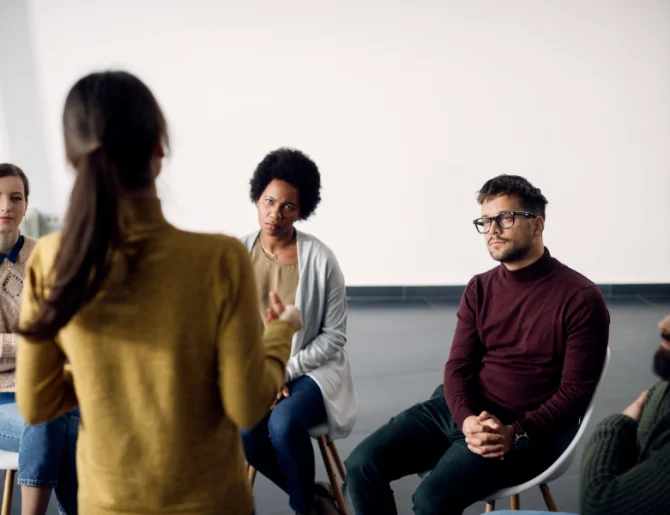 group-therapy-session-with-people-sitting-in-circle